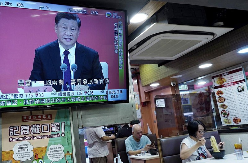 A TV at a restaurant in Hong Kong broadcasts Chinese President Xi Jinping’s speech at an event Wednesday commemorating the 40th anniversary of the establishment of the Shenzhen Special Economic Zone. (AP/Vincent Yu) 