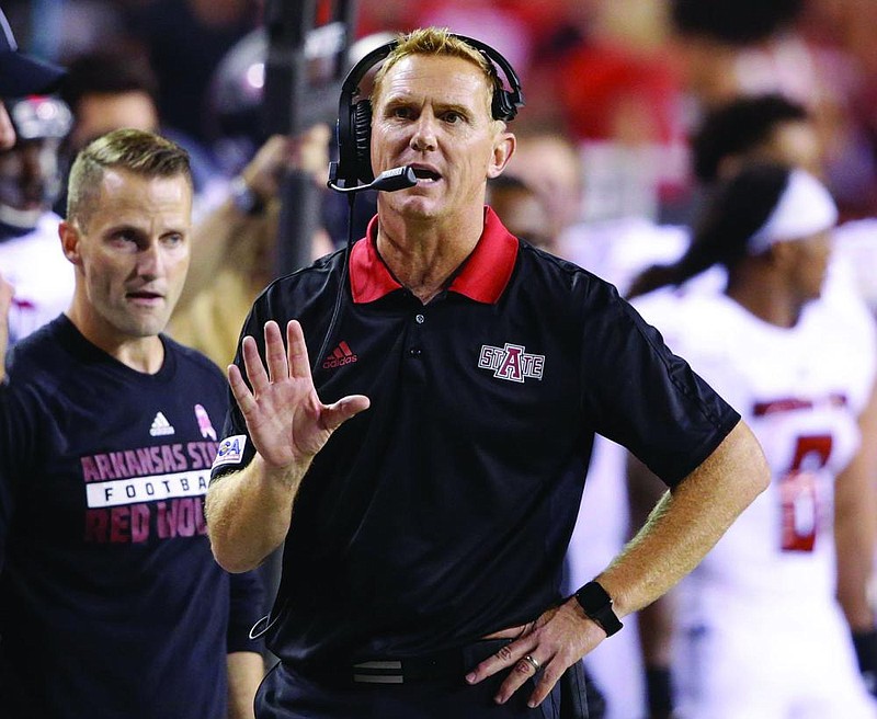 Arkansas State coach Blake Anderson talks on his headset during the second half of an NCAA college football game against Nebraska in Lincoln, Neb., Saturday, Sept. 2, 2017. Nebraska won 43-36. (AP Photo/Nati Harnik)