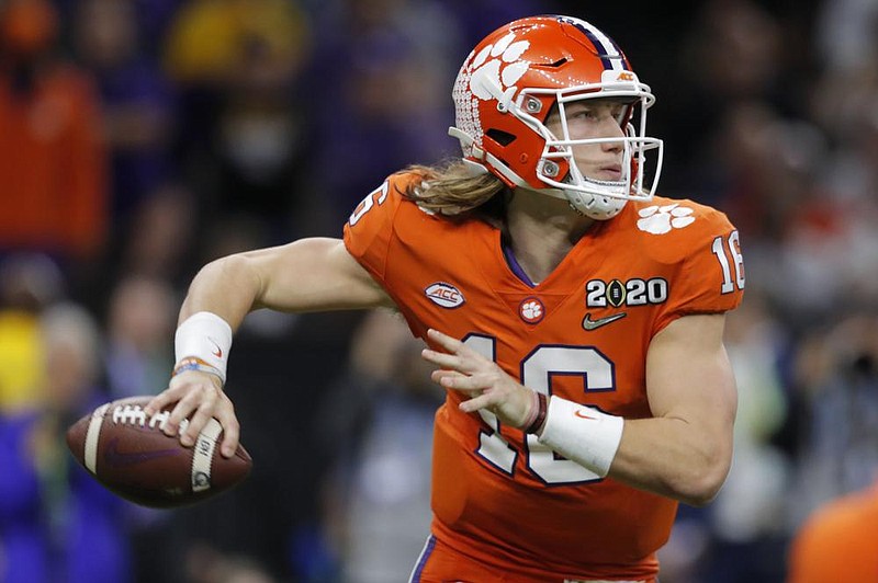 College athletes such as Clemson quarterback Trevor Lawrence would be able to earn money from endorsements and sponsorship deals through a set of proposals that will go up for a vote in January. (AP file photo) 