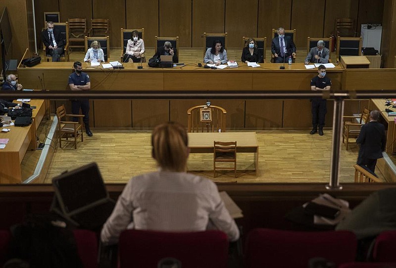 The sentencing announcement for Golden Dawn party leaders is made Wednesday in a courtroom in Athens, Greece. (AP/Petros Giannakouris) 
