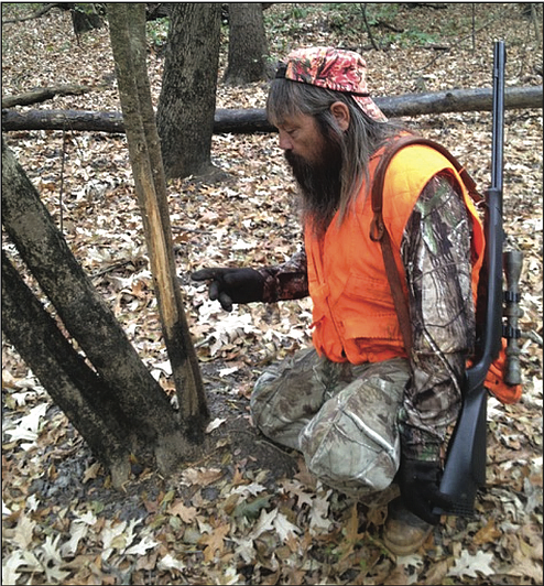 Rubs are a sure sign that an active buck is using an area, but his visits to the rub might be intermittent. (Arkansas Democrat-Gazette/Bryan Hendricks) 