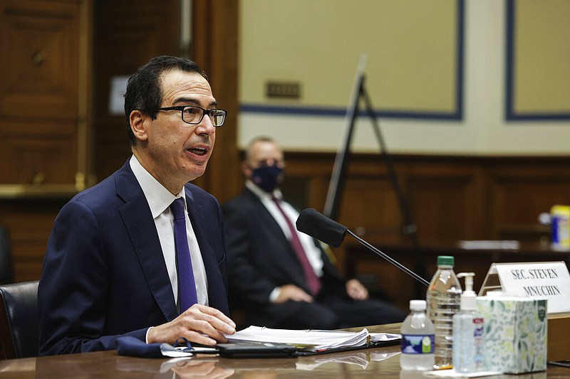 FILE - In this Sept. 1, 2020 file photo, Treasury Secretary Steven Mnuchin testifies before the House Select Subcommittee on the Coronavirus Crisis, during a hybrid hearing on Capitol Hill in Washington. The federal budget deficit hit an all-time high of $3.1 trillion in the 2020 budget year, more than double the previous record, as the coronavirus pandemic shrank revenues and sent spending soaring. The Trump administration reported Friday, Oct. 16, that the deficit for the budget year that ended on Sept. 30 was three times the size of last year's deficit of $984 billion. (Graeme Jennings/Pool via AP, File) story.lead_photo.caption