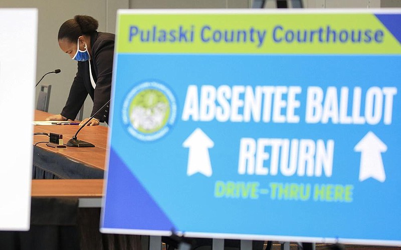 Pulaski County Clerk Teri Hollingsworth checks her notes Thursday Oct. 15, 2020 in Little Rock before a press conference with Mayor Frank Scott Jr. to announce an absentee ballot return process at the Pulaski County Courthouse.  
 (Arkansas Democrat-Gazette/Staton Breidenthal)