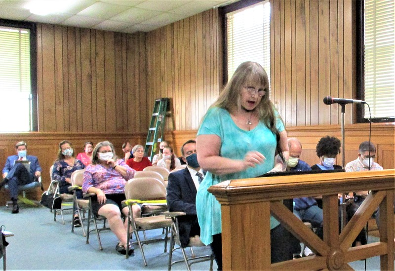 Shelli Henderson, a resident of Sunset Road, addresses the El Dorado Planning and Zoning Commission during a public hearing about a rezoning request that was submitted by T Ricks convenience store on Junction City Highway/U.S. 167. T Ricks is planning to install diesel fuel tanks on its existing footprint and is seeking to rezone undeveloped, residential property to expand its parking lot. Sunset Road residents opposed the petition during the public hearing Oct. 13. Henderson shared her perspective as a former truck driver. (Tia Lyons/News-Times)