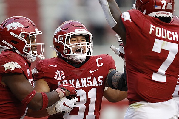 Arkansas linebacker Grant Morgan (31) celebrates after returning an interception for a touchdown during a game against Ole Miss on Saturday, Oct. 17, 2020, in Fayetteville. 