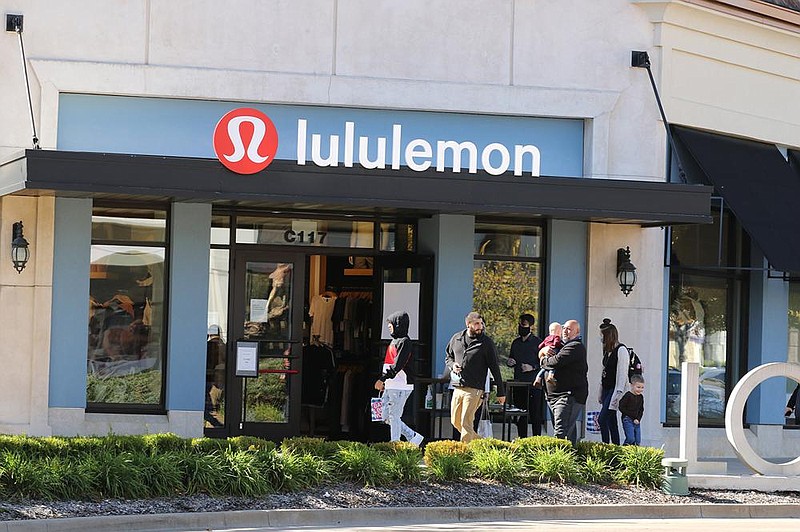 Shoppers walk around The Promenade at Chenal on Friday in Little Rock. The U.S. Commerce Department reported Friday that sales at clothing stores rose 11% last month.
(Arkansas Democrat-Gazette/Thomas Metthe)