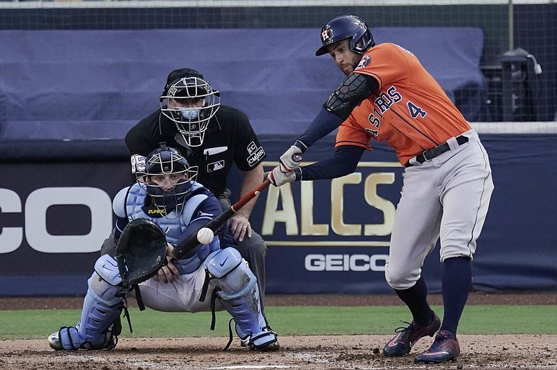 George Springer of the Houston Astros connects for the go-ahead, two-run single in a 7-4 victory against the Tampa Bay Rays in Game 6 of the American League Championship Series on Friday in San Diego. Houston won its third game in a row to tie the series at 3-3.
(AP/Jae C. Hong)