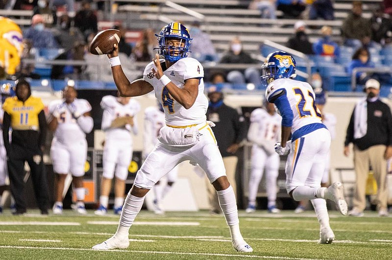 Senior quarterback Kareame Cotton threw for 274 yards with 3 touchdowns and also rushed for 49 yards and a score on 3 carries to lead North Little Rock to a 49-10 victory over Little Rock Catholic on Friday at War Memorial Stadium in Little Rock. More photos at arkansasonline.com/1017nlr/.
(Arkansas Democrat-Gazette/Justin Cunningham)