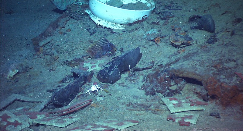 This 2004 image provided by the University of Rhode Island's Institute for Exploration and Center for Archaeological Oceanography and the National Oceanic and Atmospheric Administration's Office of Ocean Exploration shows the shoes of one of the possible victims of the Titanic disaster. A company’s plan to retrieve the Titanic’s radio has sparked a debate over whether the famous shipwreck still holds human remains. (Institute for Exploration and Center for Archaeological Oceanography/University of Rhode Island/NOAA Office of Ocean Exploration via AP) story.lead_photo.caption