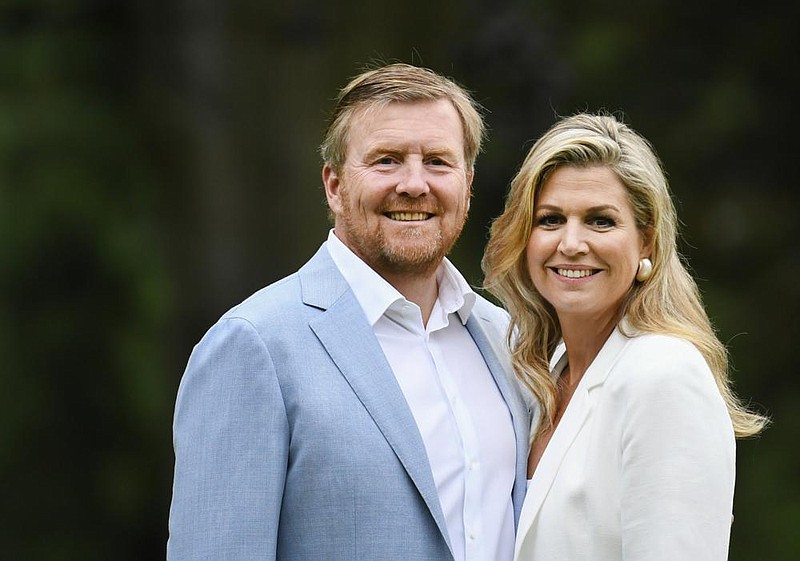 Netherlands' King Willem-Alexander and Queen Maxima pose in the garden of royal palace Huis ten Bosch in The Hague, Netherlands, Friday, July 17, 2020, during an official photo session at the start of the summer holiday. 
(Piroschka van de Wouw, Pool via AP)