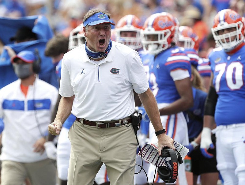 In this Oct. 3, 2020, file photo, Florida head coach Dan Mullen yells to a referee about a call during an NCAA college football game against South Carolina in Gainesville, Fla. 
 (Brad McClenny/The Gainesville Sun via AP, Pool, File)