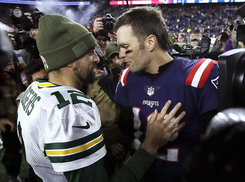 The last time Green Bay’s Aaron Rodgers (left) and Tampa Bay’s Tom Brady met in 2018, Brady was with New England and led the Patriots to a 31-17 victory. The Super Bowl-winning quarterbacks will square off for just the third time when the Buccaneers host the Packers at 3:25 p.m. Central today.
(AP file photo)