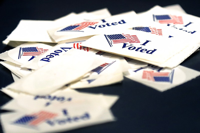 "I Voted" stickers sit on a table, Monday, Feb. 24, 2020, at the Cambridge City Hall annex, on the first morning of early voting in Massachusetts. (AP Photo/Elise Amendola)


