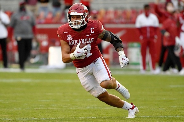 Arkansas linebacker Grant Morgan (31) returns an interception for a touchdown against Mississippi during the second half of an NCAA college football game Saturday, Oct. 17, 2020, in Fayetteville, Ark. (AP Photo/Michael Woods)