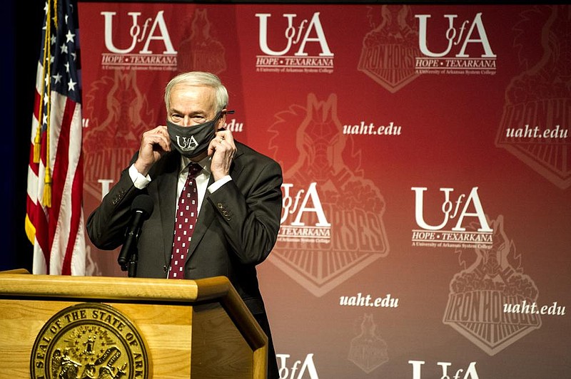 Governor Hutchinson addresses the media from Hempstead Hall Theatre at the University of Arkansas Hope-Texarkana during an update on Arkansas’ response to COVID-19 on Tuesday, Oct. 13. Hutchinson did not open this week’s update to the press due to a potential exposure to COVID-19 he learned of this week. (Arkansas Democrat-Gazette / Stephen Swofford)