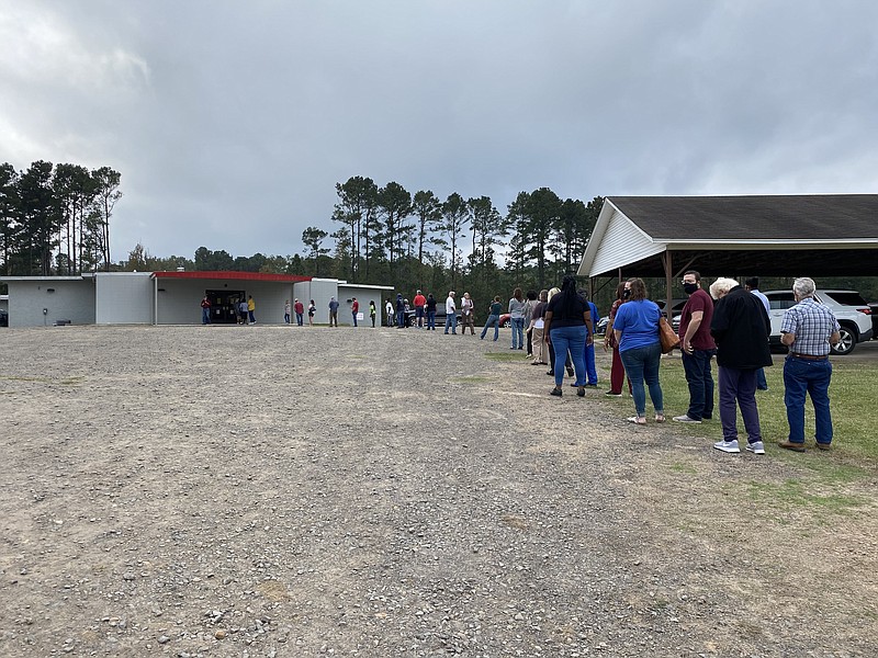 The line for early voting extended to the parking lot on day one of early voting.