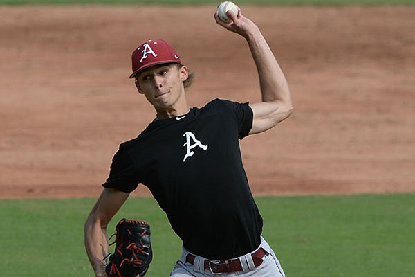 Arkansas pitcher Caden Monke delivers to the plate Friday, Sept. 18, 2020, during practice at Baum-Walker Stadium in Fayetteville.