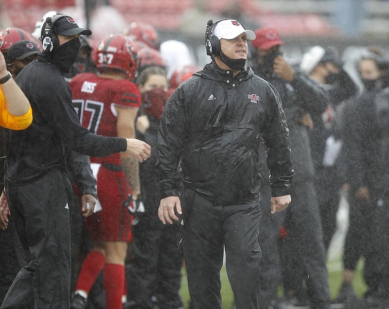 Arkansas State head coach Blake Anderson (left) and assistant coach Nick Peremski (center) yell to their players during the Red Wolves' win over Central Arkansas on Oct. 10, 2020, at Centennial Bank Stadium in Jonesboro. 
(Arkansas Democrat-Gazette/Thomas Metthe)