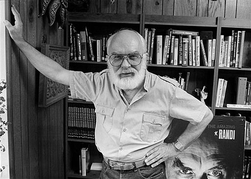 James Randi, a magician and escape artist known as "The Amazing Randi," poses at his home in Sunrise, Fla., in this Aug. 27, 1986, file photo. Randi, whose daring escapes were later eclipsed by his work as the country’s foremost skeptic, died Monday, Oct. 19, 2020, the Florida-based James Randi Educational Foundation announced Wednesday. Randi was 92.