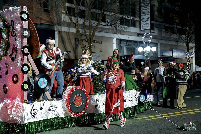 The Arlington Resort Hotel & Spa's entry in the 2019 Oaklawn Rotary Christmas Parade makes its way down Central Avenue. - File photo by The Sentinel-Record