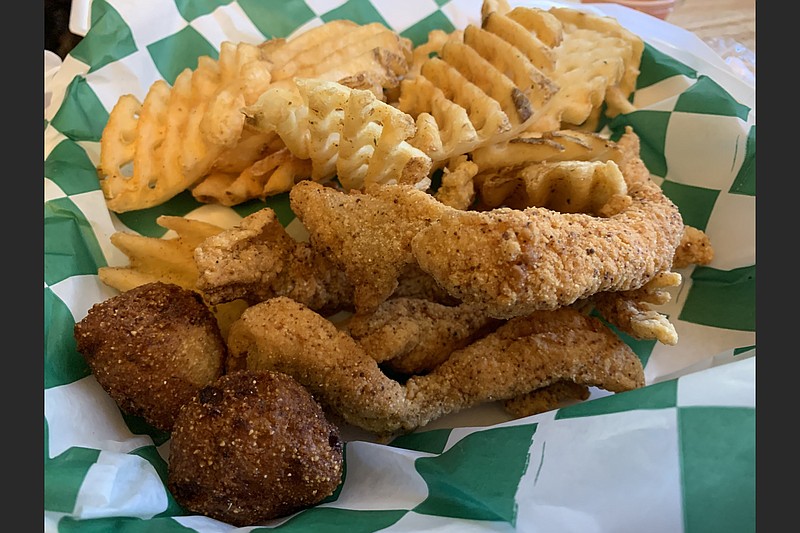 We paid for the two-piece Faith’s Fish Plate at Rock City Kitchen but actually got a third piece of fish. It comes with a side of waffle fries (shown) and slaw (withheld by request).
(Arkansas Democrat-Gazette/Eric E. Harrison)