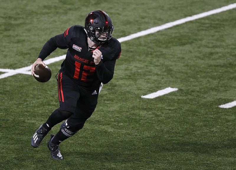 Arkansas State quarterbacks Logan Bonner (left) and Layne Hatcher have put together a quarterback rotation that has put up big numbers for the Red Wolves this season, despite the belief by many that platooning the position rarely works. “For Logan and Layne to be so similar and for the offense to not change when either goes in, to me, is the remarkable part,” ESPN color analyst Mike Golic Jr. said. 
(Arkansas Democrat-Gazette/Thomas Metthe) 