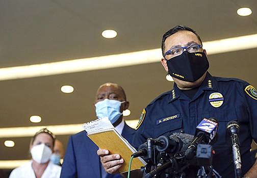 Houston Police chief Art Acevedo talks to reporters about the death of Sgt. Harold Preston, at Memorial Hermann Hospital on Tuesday, Oct. 20, 2020, in Houston. Two officers were shot by a suspect during a domestic violence call at an apartment complex. (Godofredo A. Vásquez/Houston Chronicle via AP)