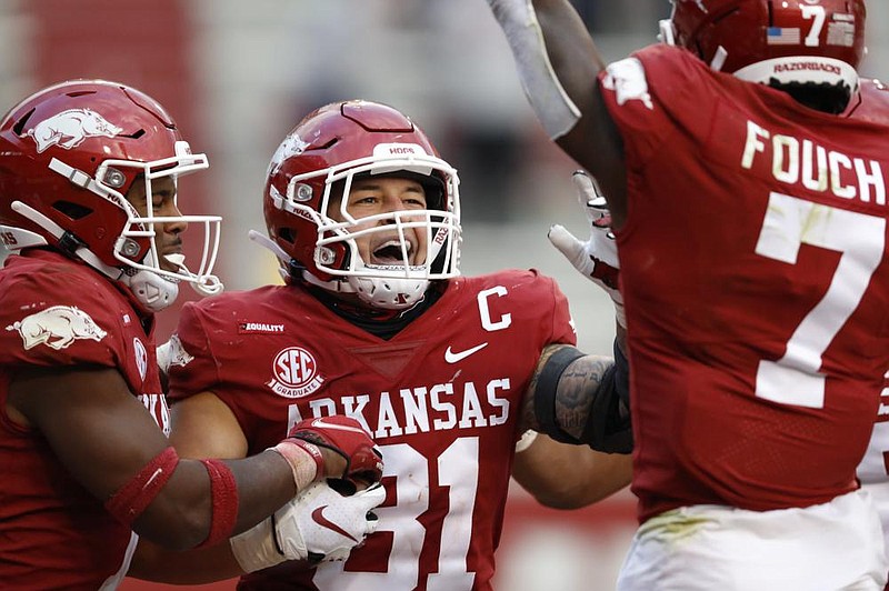 Arkansas senior linebacker Grant Morgan (center) has continued to garner accolades after recording a career-high 19 tackles, 3 tackles for loss, 2 pass breakups, 1 sack and returning an interception for a touchdown during Saturday’s victory over Ole Miss. (University of Arkansas/Michael Morrison) 