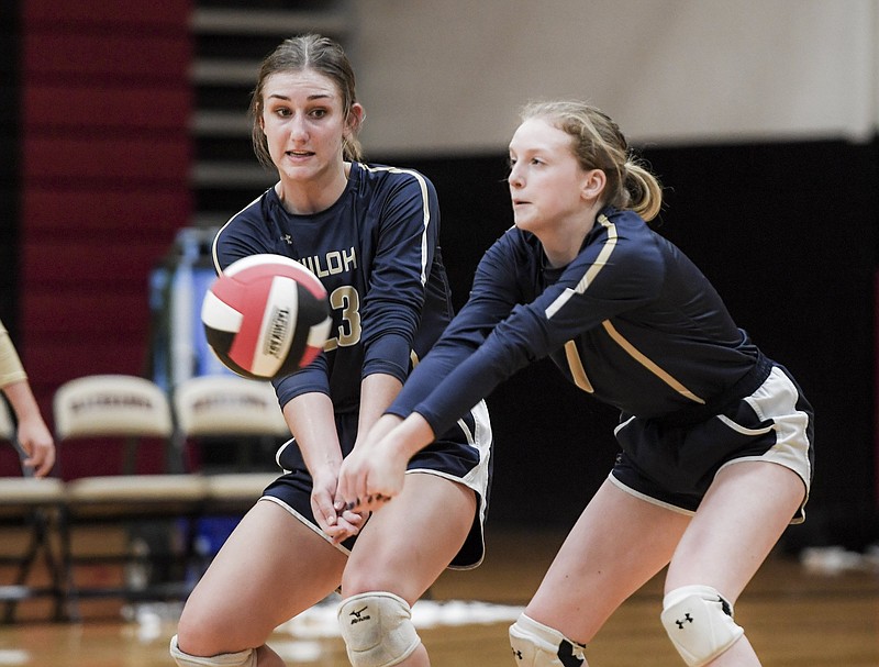 FILE -- Shiloh Christian High School Lexi Richards (23) and Kassie Boyett (1) dig during a championship match of the 4A-1 Conference volleyball tournament, Thursday, October 18, 2018 at Pea Ridge High School in Pea Ridge. (NWA Democrat-Gazette/CHARLIE KAIJO)