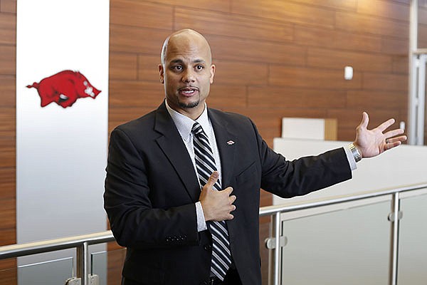 Arkansas associate athletics director Eric Wood speaks to reporters during a tour of the Jerry and Gene Jones Family Student-Athlete Success Center on Monday, Oct. 12, 2015, in Fayetteville.