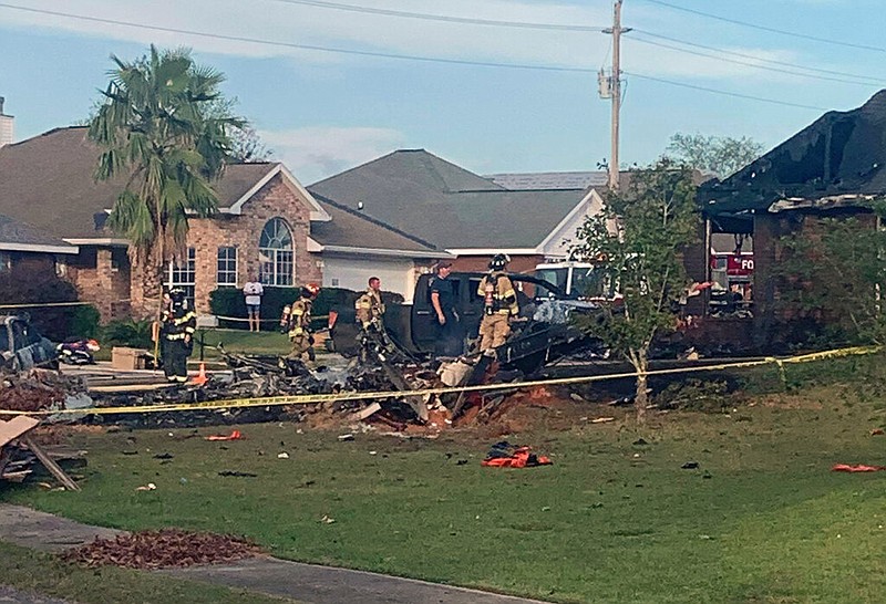 This photo provided by Greg Crippen shows the scene where a U.S. Navy training plane crashed near Foley, Ala., in a residential neighborhood near the Gulf Coast on Friday, Oct. 23, 2020.


