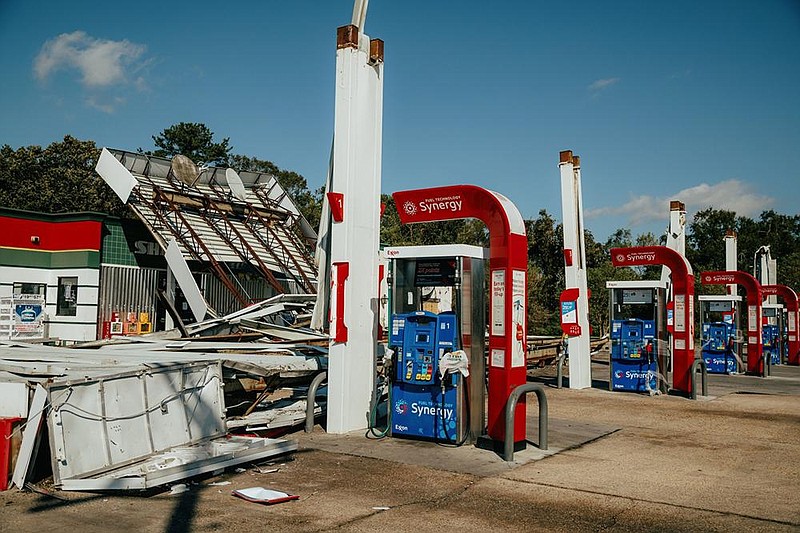 An Exxon Mobil Corp. gas station is in ruin after Hurricane Delta struck Oct. 10 near Abbeville, La. Low oil prices has the company delaying major projects and laying off some employees.
(Bloomberg News/Bryan Tarnowski)