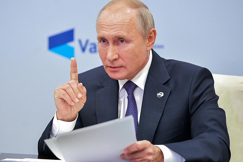 Russian President Vladimir Putin speaks Thursday at the annual meeting of the Valdai Discussion Club via video conference from the Novo-Ogaryovo residence outside Moscow.
(AP/Sputnik/Alexei Druzhinin)