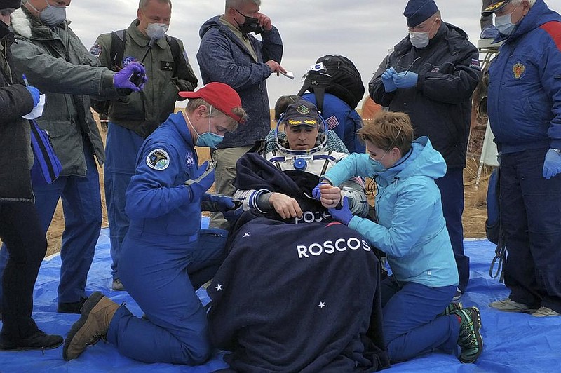 In this photo released by Rosaviatsiya, NASA astronaut Chris Cassidy sits in a chair Thursday shortly after he and two Russian cosmonauts landed near Dzhezkazgan, Kazakhstan, completing a six-month mission on the International Space Station.
(AP/Rosaviatsiya)