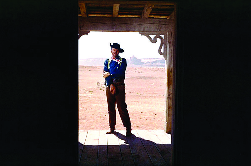Ethan Edwards (John Wayne) stands in the doorway of the Jorgensens at the end of his finest performance in “The Searchers,” arguably John Ford’s best Western.