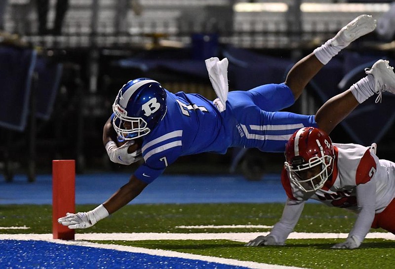 FILE — Bryant receiver Cory Nichols (7) dives over Cabot cornerback Tyler Parks (2) for a touchdown during a game at Hornet Stadium in Bryant on Oct. 23, 2020. (Special to the Democrat-Gazette/Jimmy Jones)