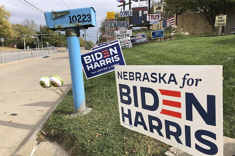 A Joe Biden presidential campaign sign greets passersby in a leafy neighborhood of Omaha, Neb., Monday, Oct. 19, 2020. If the election is close, Nebraska could play a pivotal role in deciding the winner because the state is able to divide its electoral votes, as it did when President Barack Obama won the Omaha-based 2nd Congressional District in 2008. Maine is the only other state that awards Electoral College votes by congressional district, and it could go the opposite way and award a vote to Donald Trump even as the state as a whole likely will go to Biden.