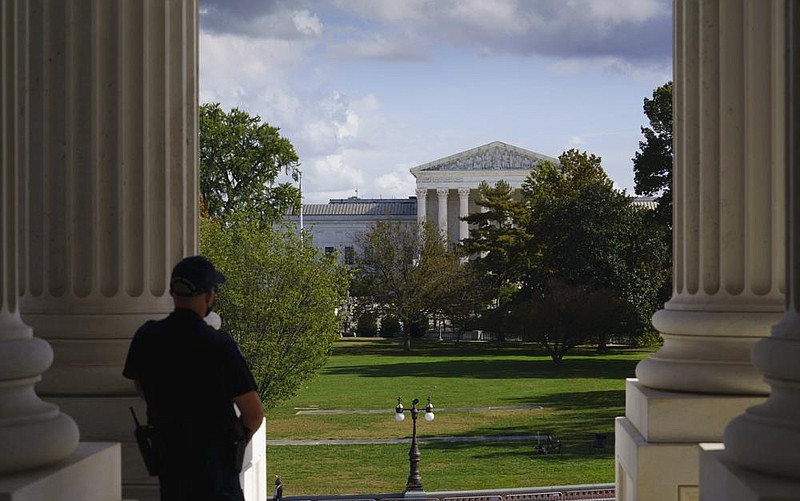A U.S. Capitol police officer looks Friday toward the Supreme Court building from the entrance to the Senate in Washington.
(AP/J. Scott Applewhite)