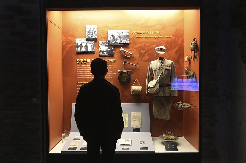 A visitor looks at a Chinese military uniform and equipment used during the Korean War at the The War Memorial of Korea in Seoul, South Korea, on Friday.
(AP/Ahn Young-joon)