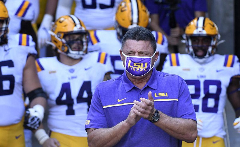 LSU Coach Ed Orgeron has dealt with most of his team contracting covid-19 before the season started, so he hopes those players won’t catch it a second time.
(AP/L.G. Patterson)