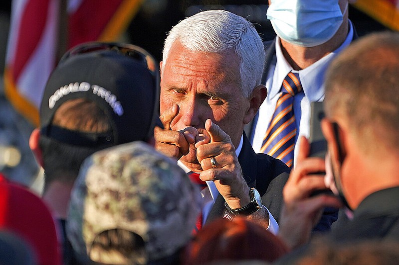 Vice President Mike Pence works the crowd after delivering remarks at a campaign rally at Allegheny County Airport in West Mifflin, Pa., on Friday, Oct. 23, 2020. White House officials on Sunday, Oct. 25, rejected dialing back Pence's in-person campaigning despite positive coronavirus tests from several of his aides.