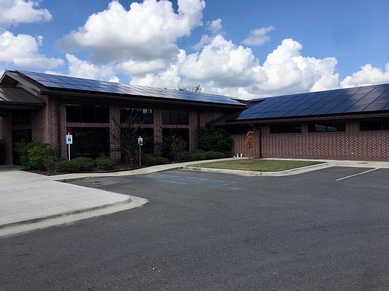 The Family Care of South Arkansas medical clinic recently converted its building to solar energy with the help of AEV Solar, a solar panel company based in Little Rock. Dr. Robert Watson said the conversion will save the business an estimated $279,000 over 25 years. (Marvin Richards/News-Times)