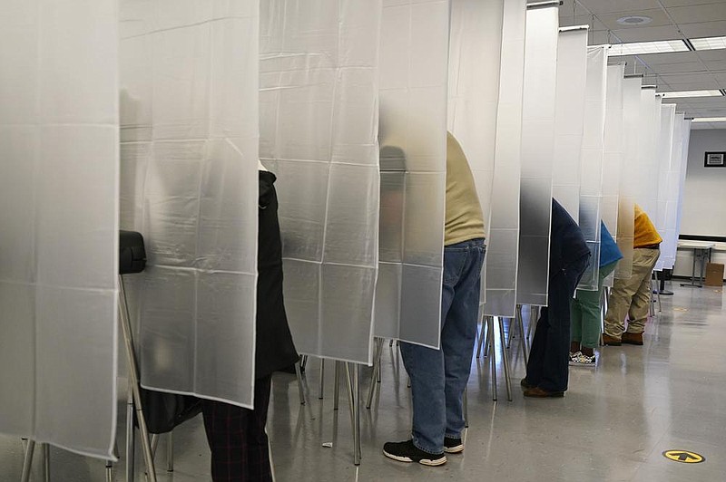 Voters fill out their ballots earlier this month at the Cuyahoga County Board of Elections in Cleveland. The Cybersecurity and Infrastructure Security Agency, which President Donald Trump signed into existence in 2018, is working with other parts of the government to safeguard an election in the middle of a pandemic.
(AP/Tony Dejak)