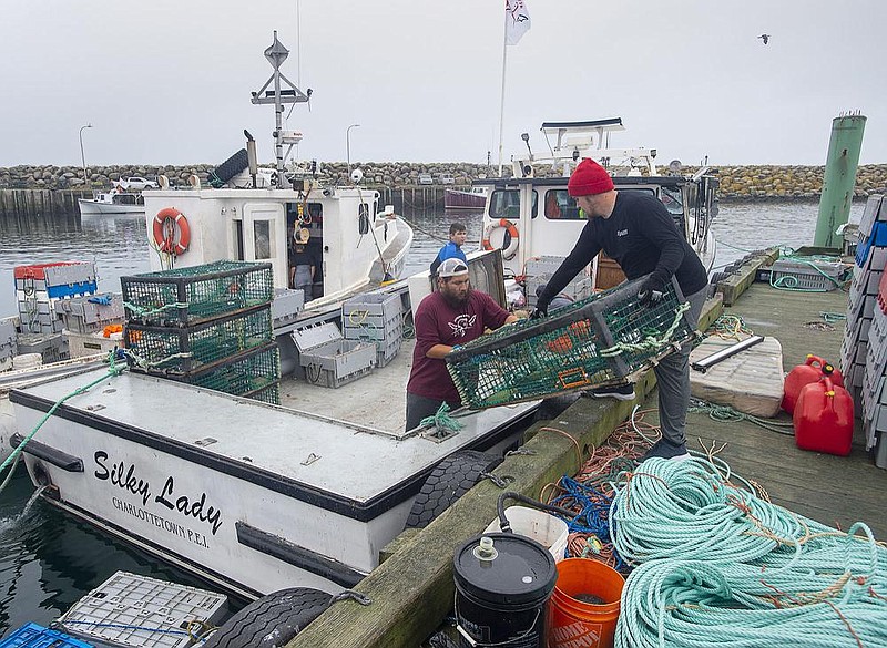 Indigenous lobstermen prepare their boats for a trapping run Wednesday in Saulnierville, Nova Scotia. Residents of the village say they have been shaken by the recent violence as tensions escalate  over Canada’s lucrative lobster trade.
(AP/The Canadian Press/Andrew Vaughan)