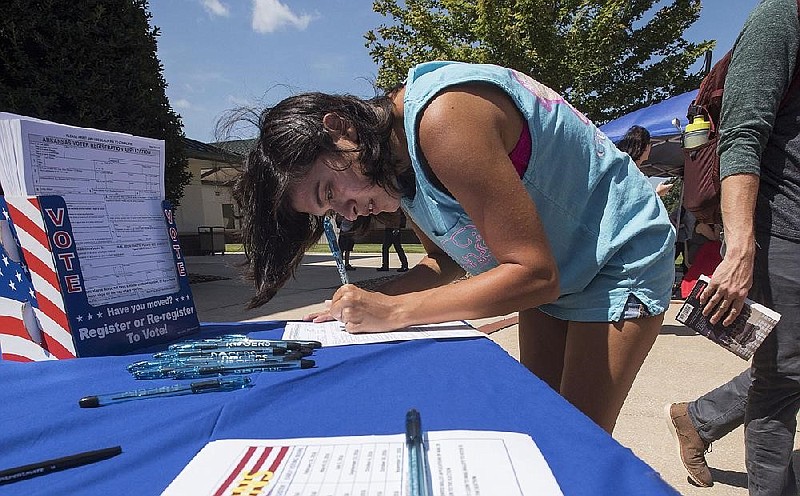 Ashley Morales registers to vote on the Northwest Arkansas Community College campus in Benton County in this August 2016 file photo. Morales was a student at the time of the photo.