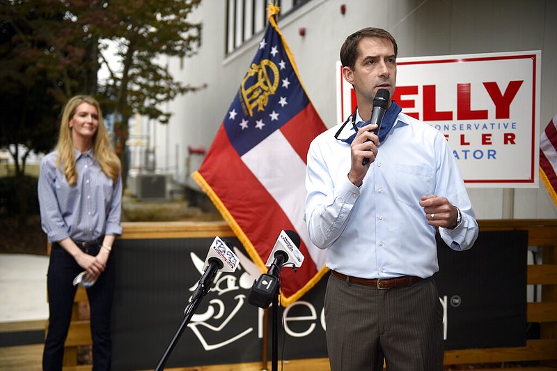 FILE - In this Oct. 12, 2020, file photo, Sen. Tom Cotton, R-Ark., right, speaks during a campaign event for Sen. Kelly Loeffler, R-Ga., left, at the Recteq facility in Evans, Ga. Six years after being elected in an expensive and heated race, Republican Sen. Tom Cotton is on the ballot again and he's campaigning hard — just not in Arkansas. (Michael Holahan/The Augusta Chronicle via AP, File)