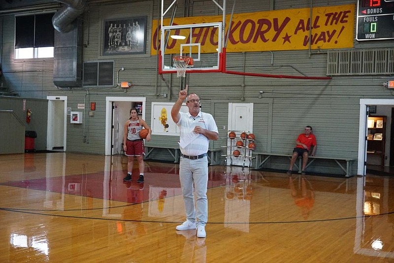 Arkansas women’s basketball Coach Mike Neighbors participates in a clinic in Knightstown, Ind., at a gym used during the filming of the 1986 movie “Hoosiers.” Neighbors, an admitted movie junkie, lists “Hoosiers” as one of his favorites. 
(Photo courtesy of Mike Neighbors) 
