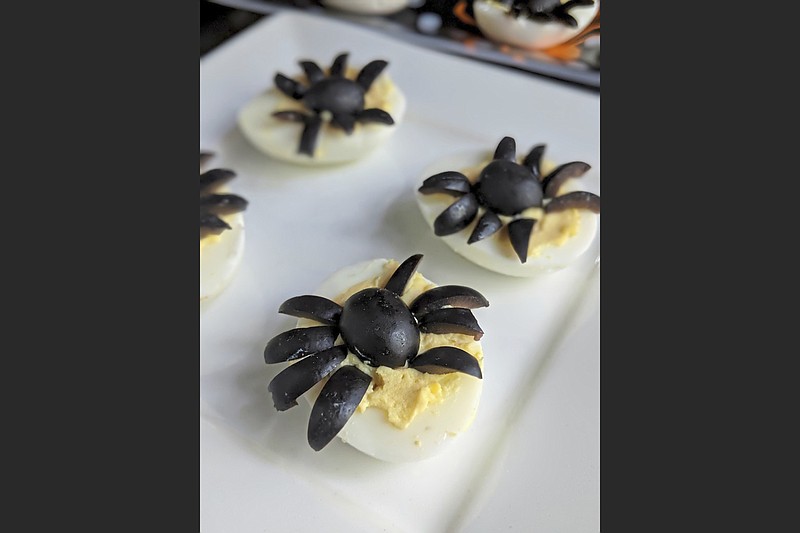Sliced black olives turn a standard deviled egg into one that looks like a spider. (Gretchen McKay/Pittsburgh Post-Gazette/TNS)