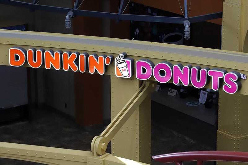 A Dunkin’ Donuts shop is shown earlier this year at the Greater Pittsburgh International Airport in Moon, Pa. About 13,000 Dunkin’ stores and 8,000 Baskin-Robbins outlets operate worldwide un- der Dunkin’ Brands Group. 
(AP/Gene J. Puskar) 