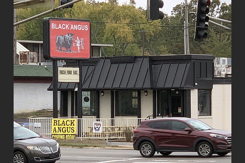 Black Angus opened Monday at West Markham and Van Buren streets; also on Monday, a red-and-black "now open" banner replaced the "coming soon" flag on the front railing. (Arkansas Democrat-Gazette/Eric E. Harrison)